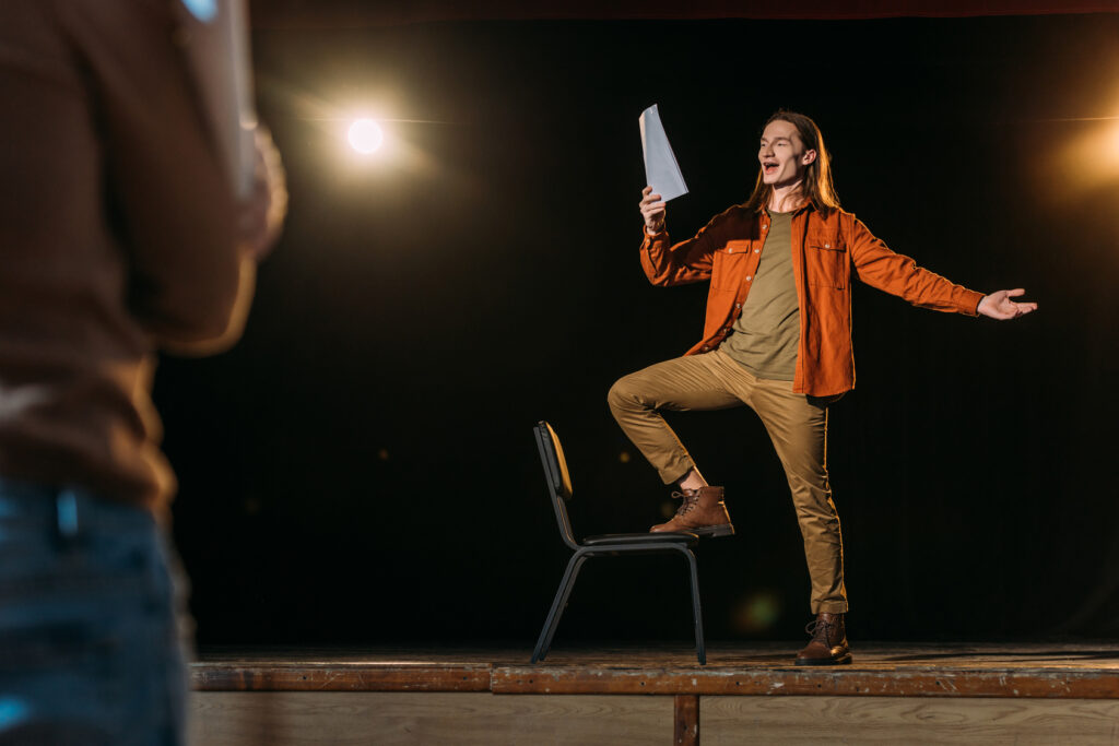 A young actor rehearsing with a script