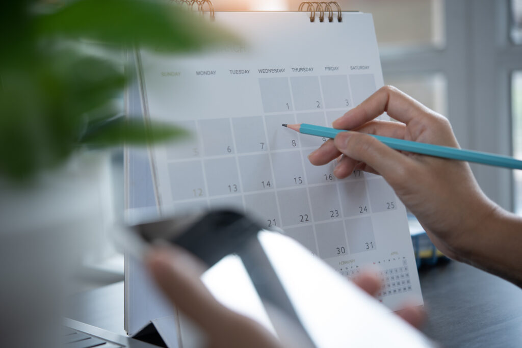 A planner with a schedule and timetable on a desk