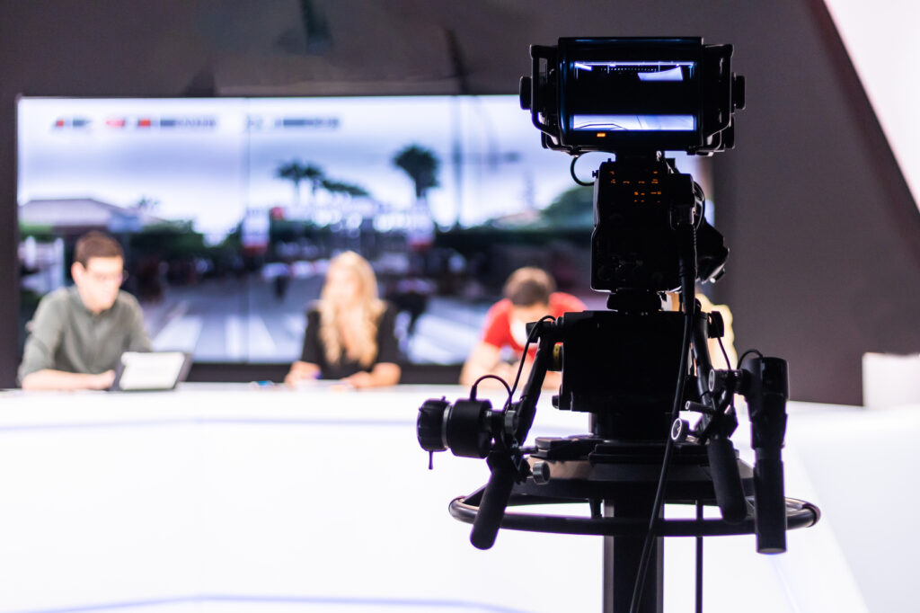 A television studio with cameras and lights